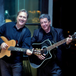 Mike and Steve Warriner at a charity event. One is the better guitar player. Mike and Steve Warriner at a charity event. One is the better guitar player.